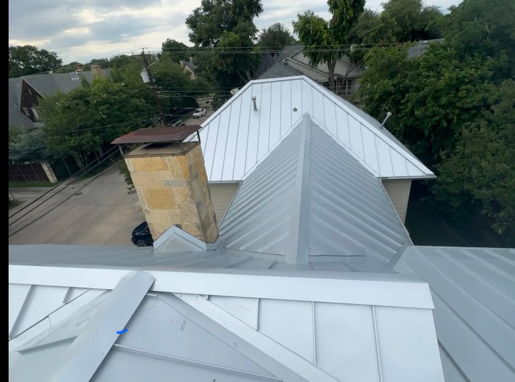 Metal roof installation on a residential home in University Park, Dallas County, TX by Under One Roof