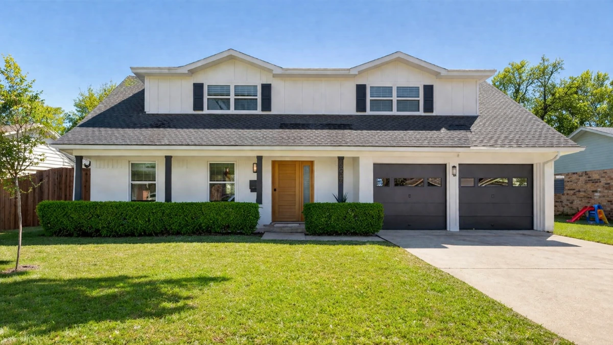 Modern two-story white home with new dark asphalt shingle roof, black shutters, and manicured landscaping in Richardson, TX