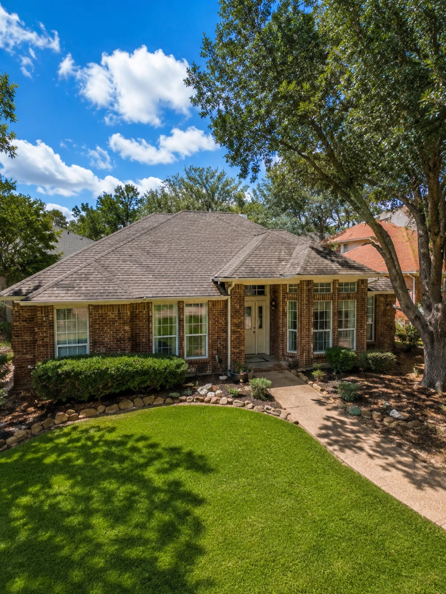 Aerial view of a home with a well-maintained roof, excellent for a roof inspection in Carrollton, Dallas County, TX.