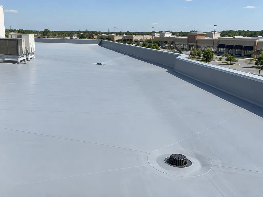 New flat roof installation with roof drains on a Farmers Branch retail center