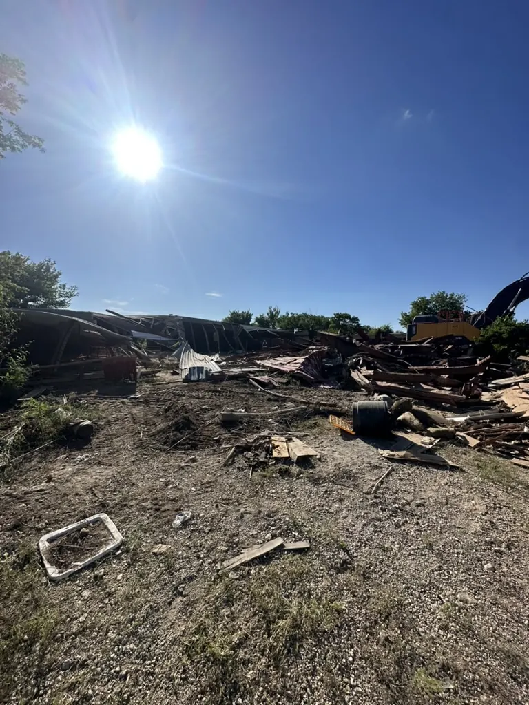House Demolition Farmers Branch: House demolition debris spread across the lot before haul-off House demolition debris spread across the lot before haul-off