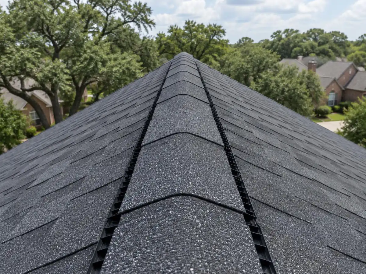 Continuous ridge vent on a new shingle roof in Farmers Branch, TX