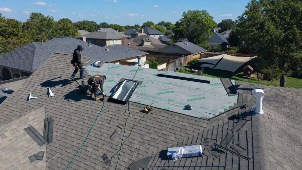 Under One Roof crew setting a skylight and flashing it into new underlayment on a residential roof in Farmers Branch, Dallas County, TX.