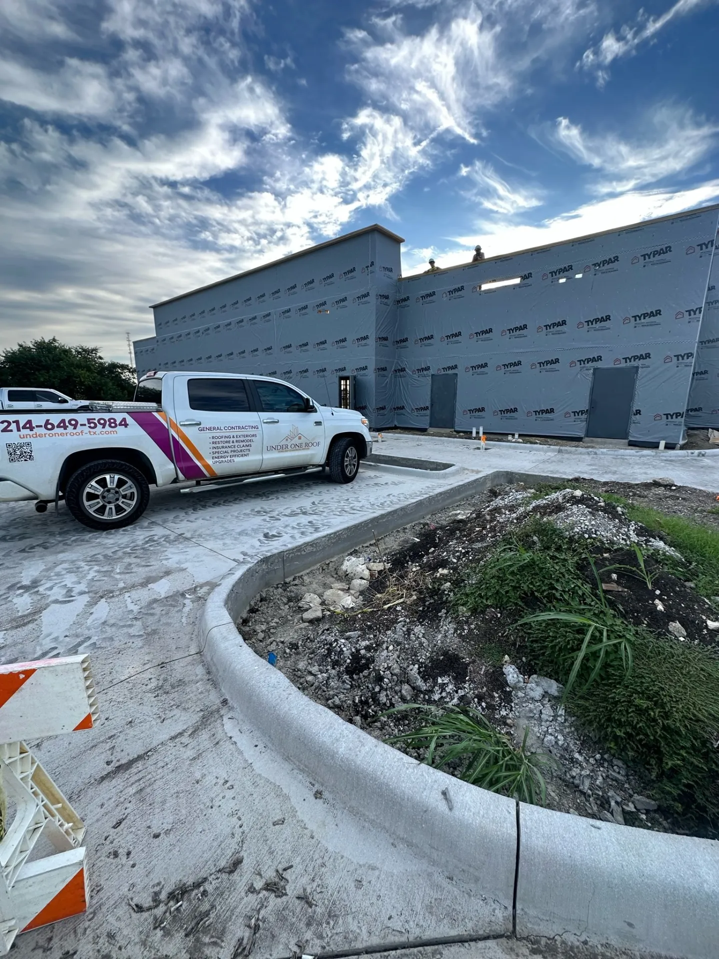 Under One Roof truck and team at commercial roofing project site in Waxahachie