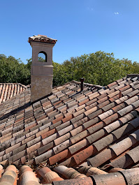 Clay tile roof before restoration in Dallas showing weathered tiles