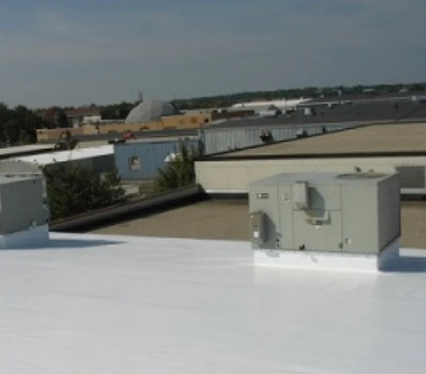 Completed commercial roof installation in Waxahachie showing professional finish with HVAC systems