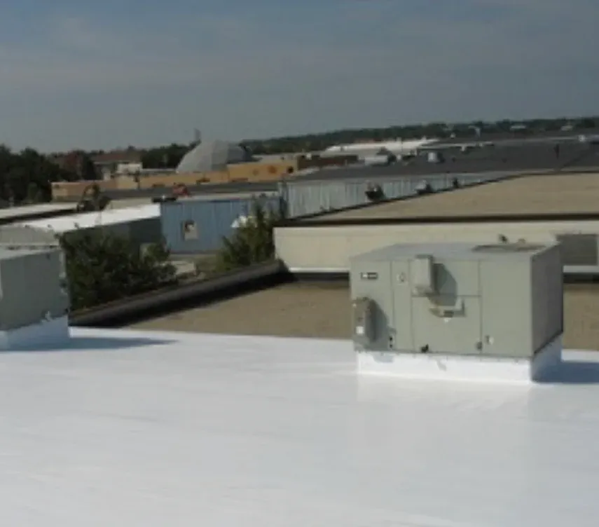 Completed commercial roof installation in Waxahachie showing professional finish with HVAC systems