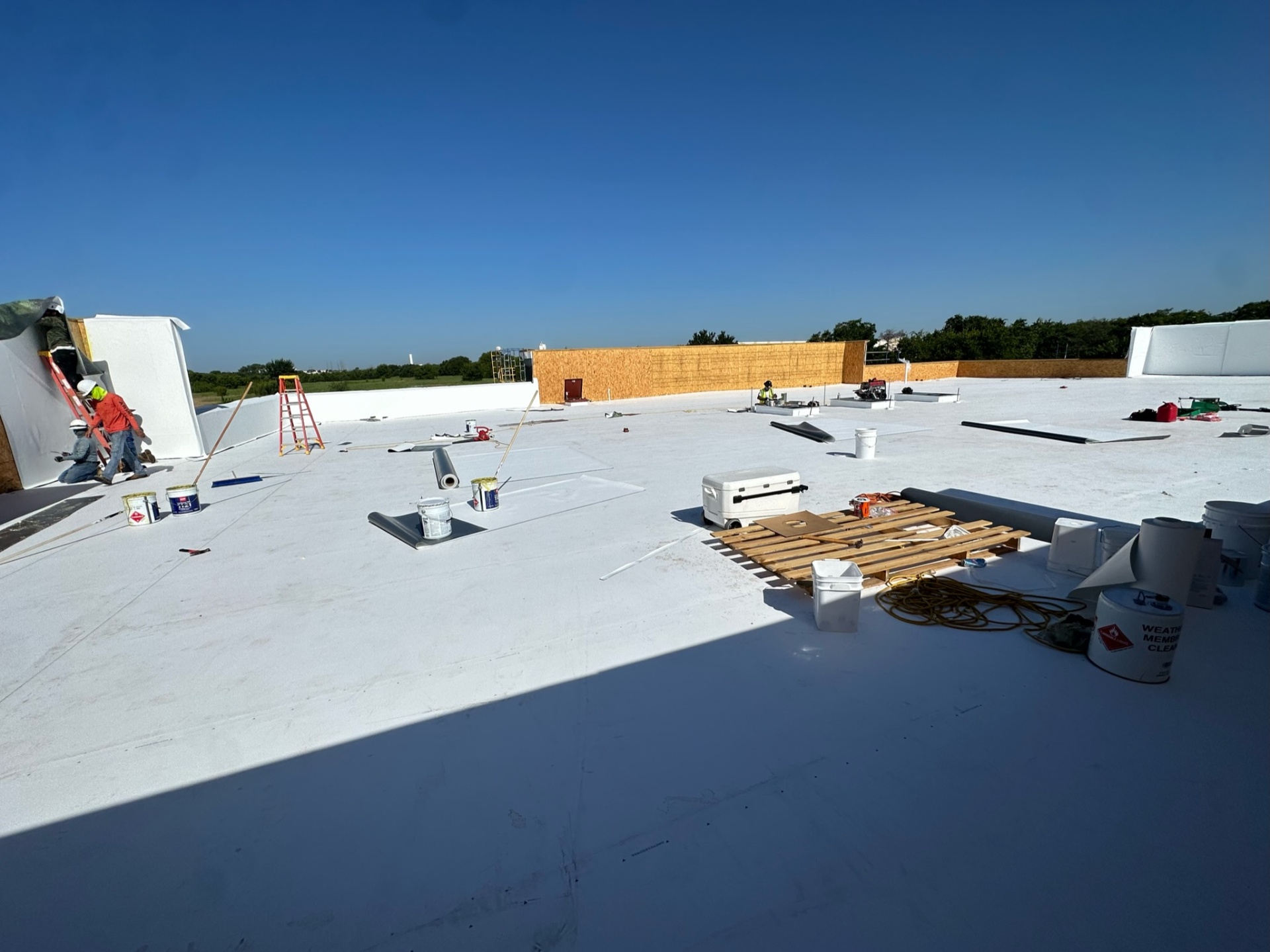 Under One Roof team installing commercial roofing system in Waxahachie, Texas