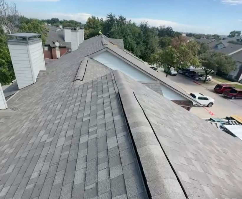 Completed multi-unit residential roof installation on townhouse in DFW, showing professional shingle roofing work and proper installation techniques