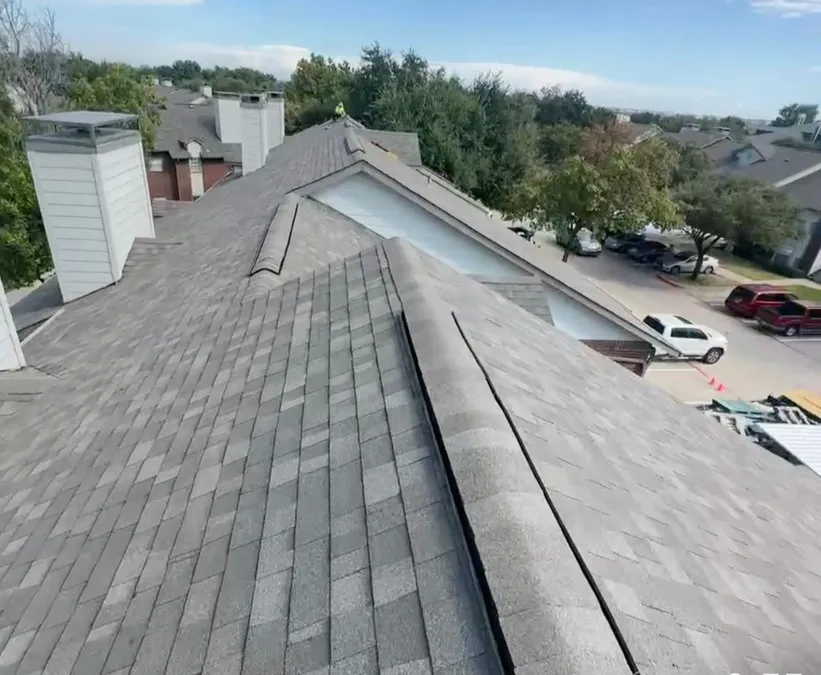 Completed multi-unit residential roof installation on townhouse in DFW, showing professional shingle roofing work and proper installation techniques