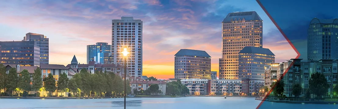 Irving Texas downtown skyline with office buildings at golden hour sunset, representing the dynamic city served by Under One Roof roofing and home services