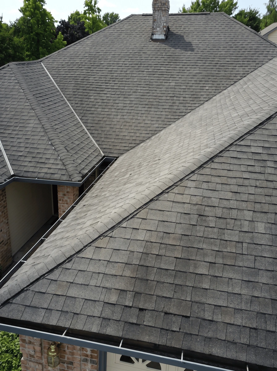 Aerial view of a Dallas shingle roof showing algae staining across the slopes